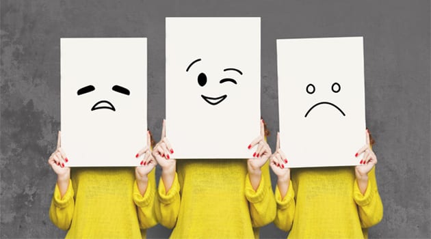 girl-covering-face-with-white-boards-set-of-PJ3MXZZ